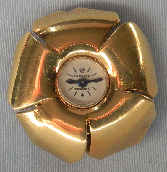 Fine and rare Cartier 18K gold ladies flower form clip watch circa 1910.